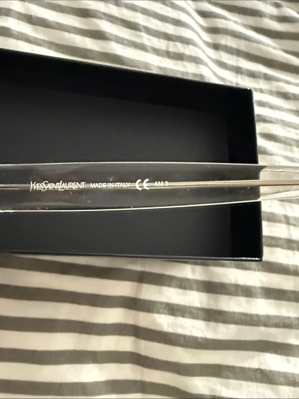 Yves Saint Laurent Clear Frame Black Lens Round Sunglasses